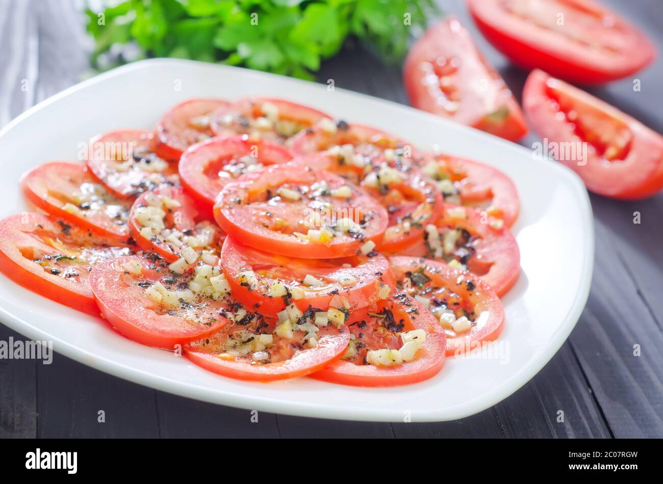 tomato with basil and garlic Stock Photo - Alamy