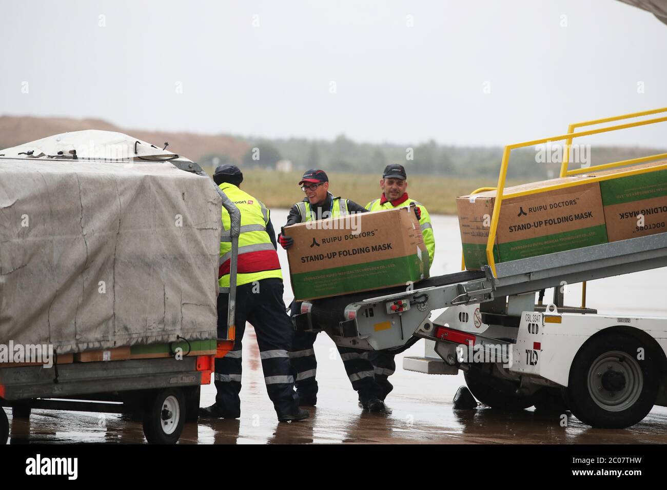 Boxes of Personal Protection Equipment (PPE) are unloaded from a plane at Robin Hood Airport in Doncaster, South Yorkshire. ??30,000 worth of PPE has been donated to the Mask Our Heroes charity, which was set up by entrepreneur Matthew McGahan in the wake of the coronavirus outbreak to help supply frontline NHS and health workers with the protective equipment they need. Stock Photo