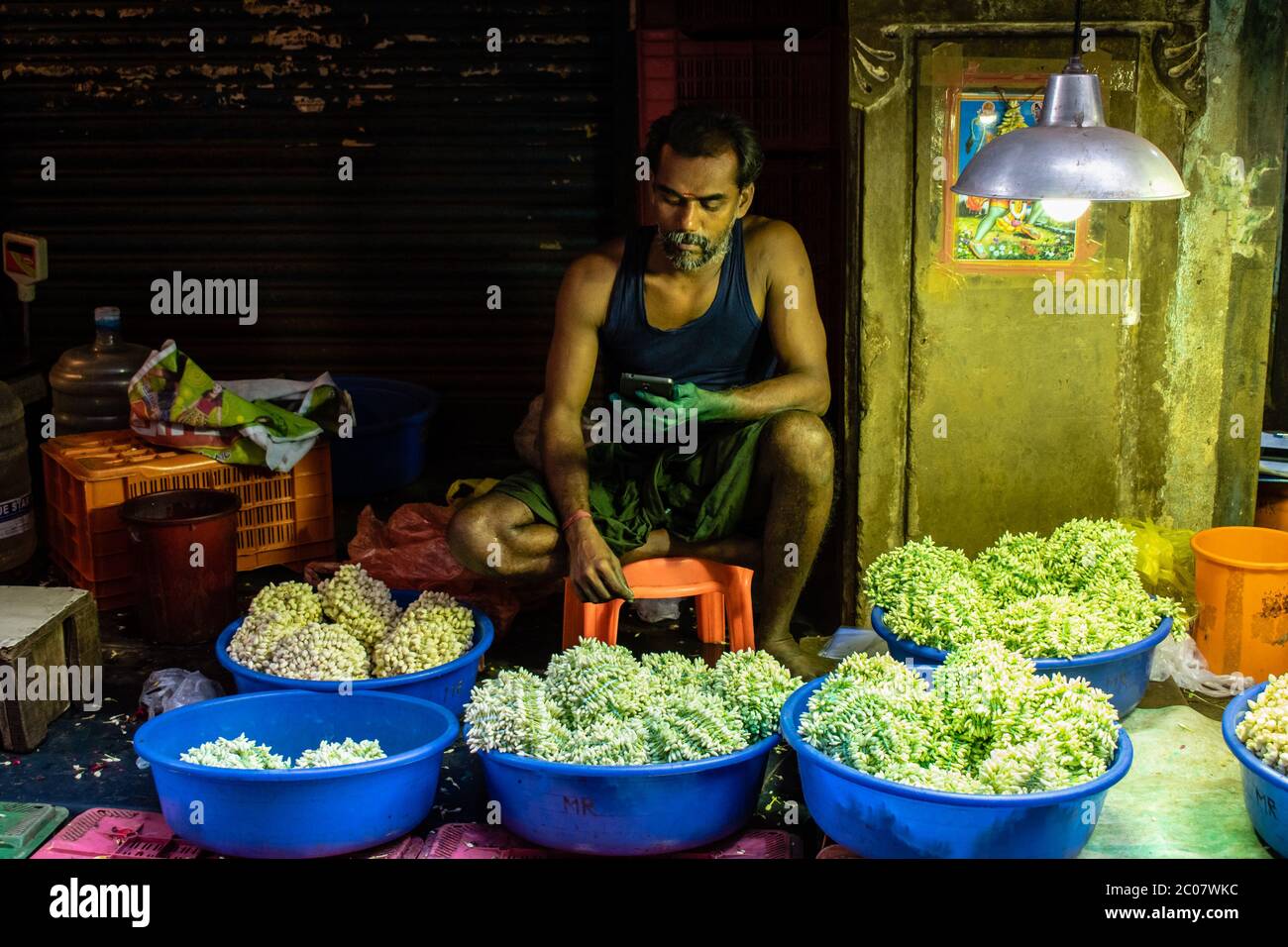 Chennai, Tamil Nadu, India August 2018 An Indian man selling flowers