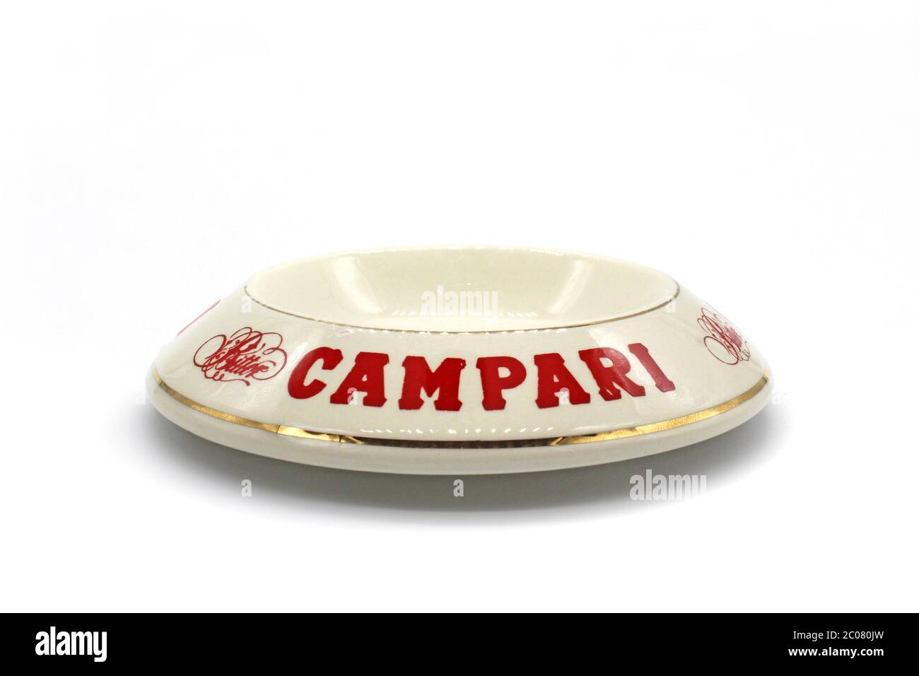 Ceramic ashtray with Campari, isolated on a white background, close up Stock Photo