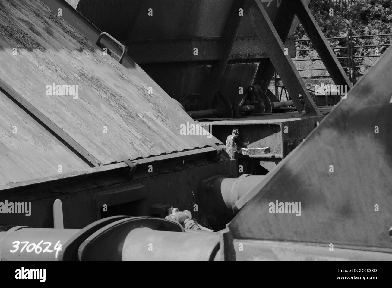 Vintage victorian railway track with huge train wheels in close up, black and white photography Stock Photo