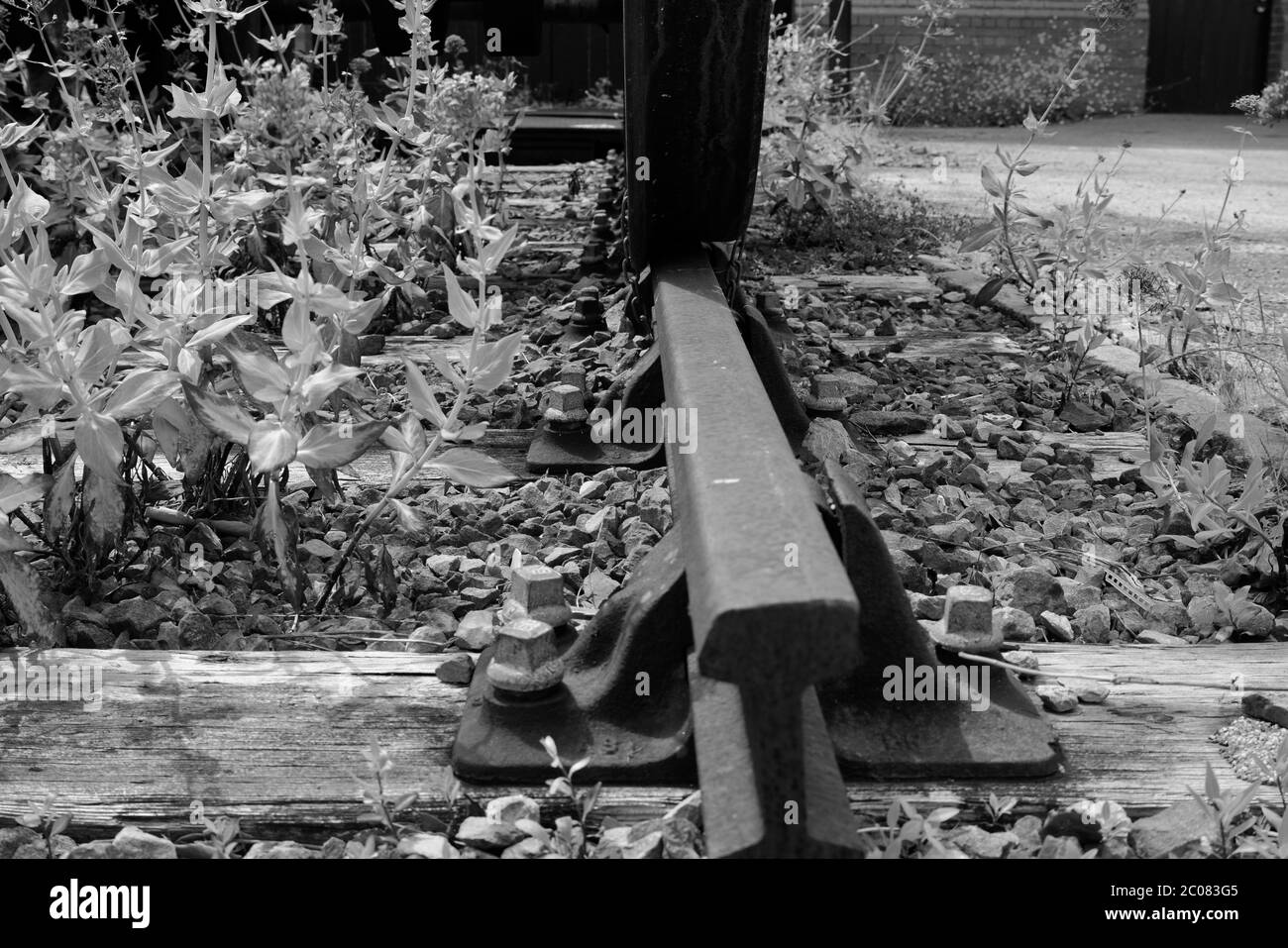 Vintage victorian railway track with huge train wheels in close up, black and white photography Stock Photo