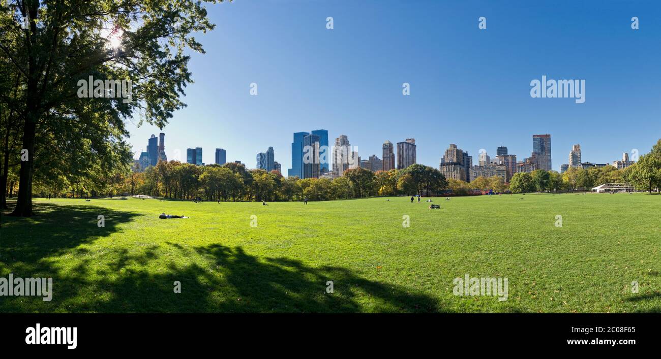 Panorama of Sheep Meadow in Central Park looking to Manhattan skyline. Stock Photo