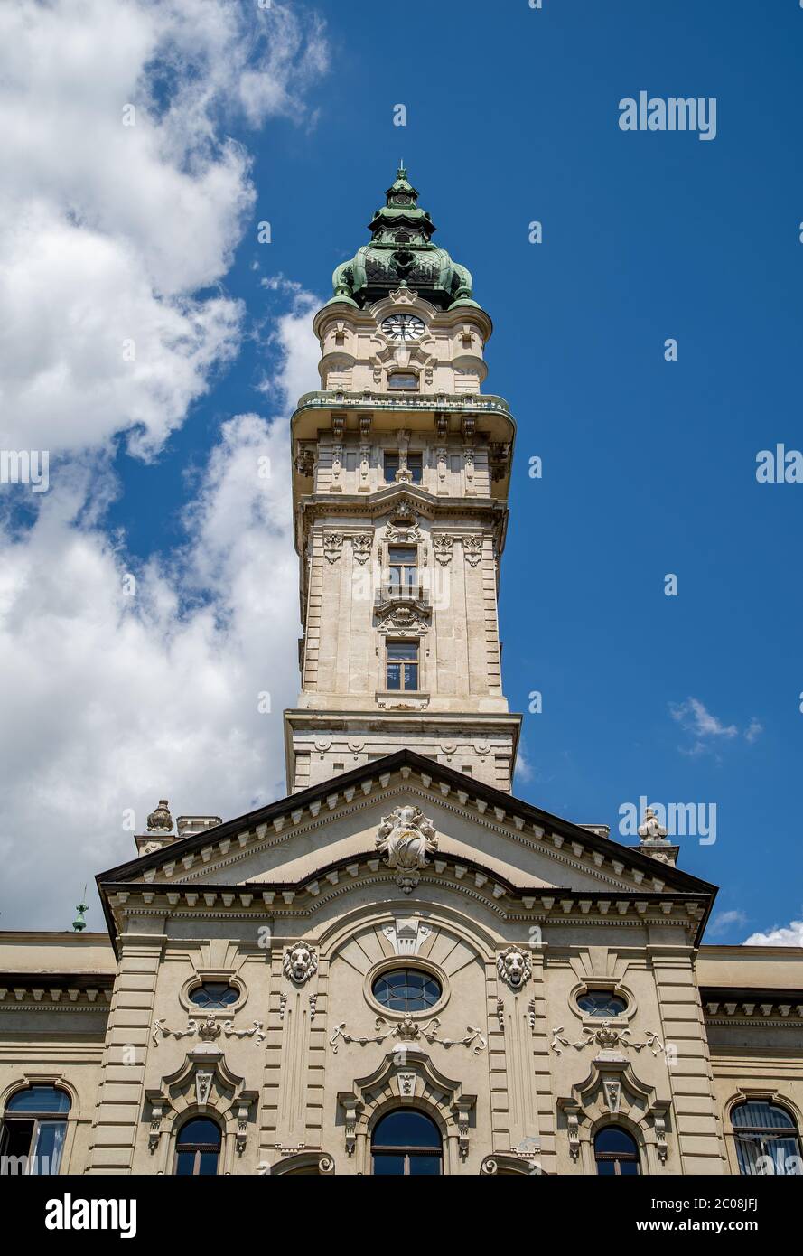 Detail of the back front of City Hall of Gyor. Hungary. The eclectic style building was completed in 1900.The 59-meter clock tower. Stock Photo