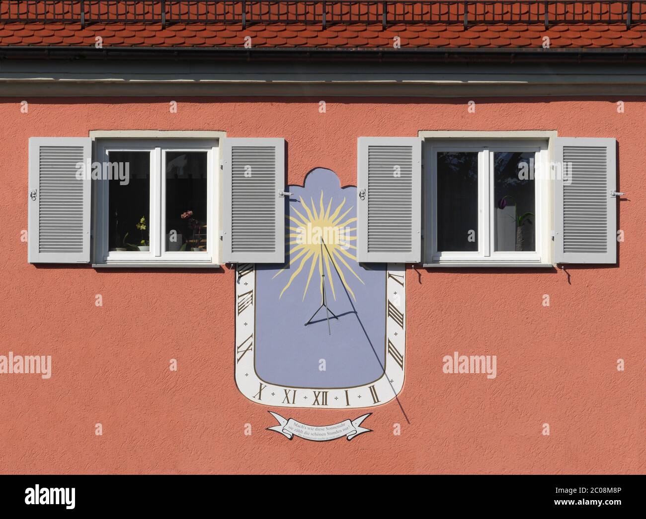 Facade with sundial of a house in Meersburg Stock Photo
