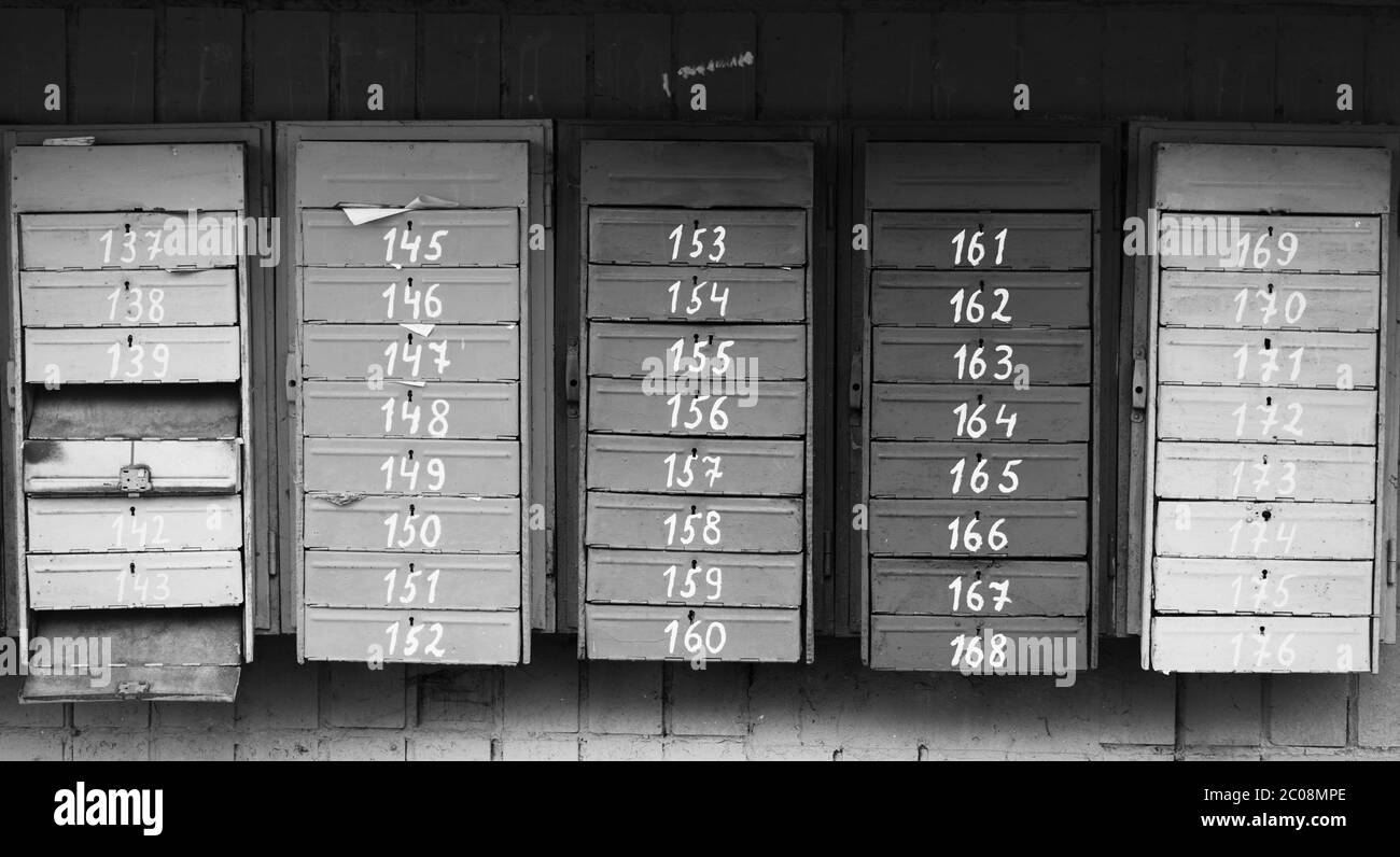 Old vintage post boxes. Black and white toned image. Stock Photo