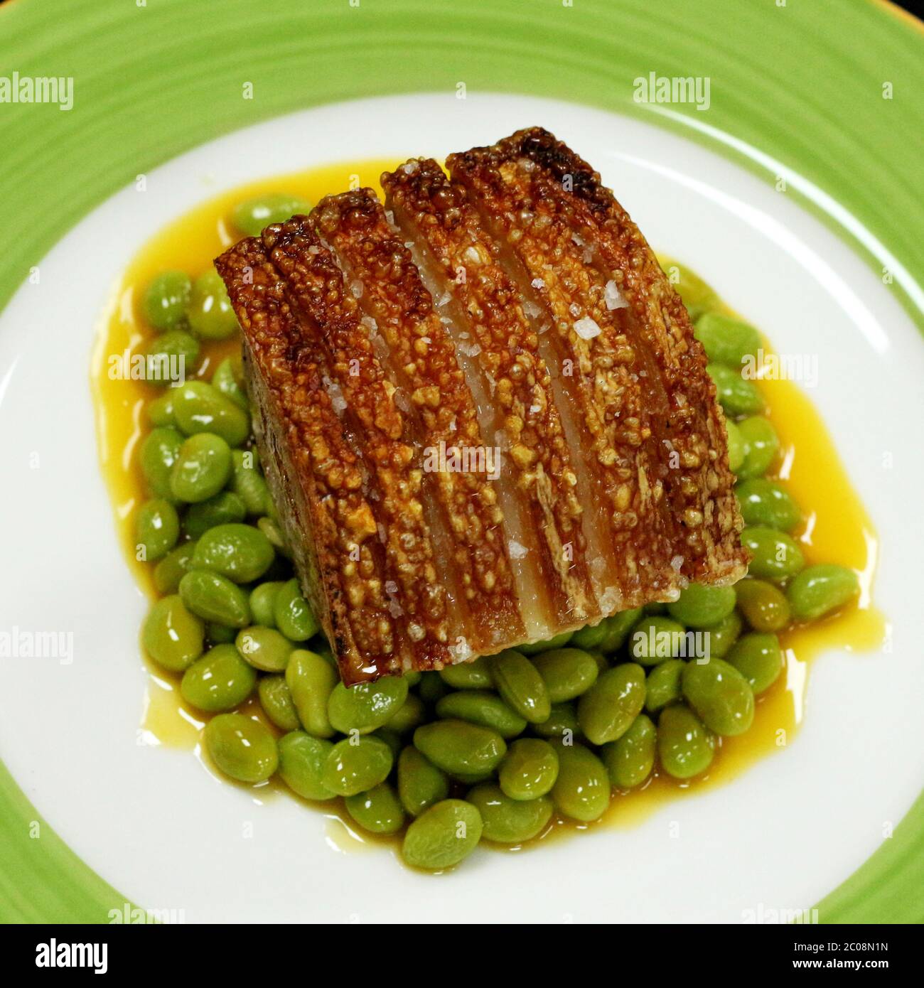 pork belly with green soybeans and orange sauce Stock Photo Alamy