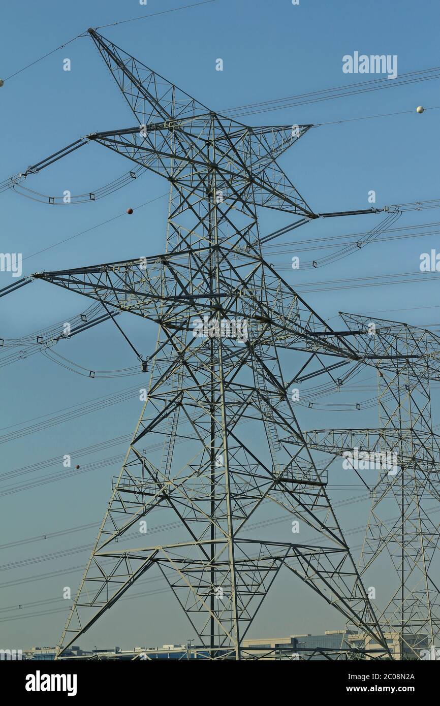 high voltage electric tower line with blue sky background Stock Photo ...