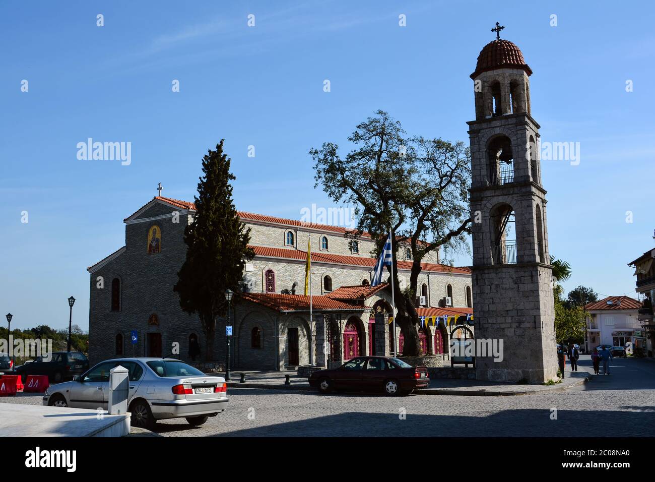 LITOCHORO, GREECE - APRIL 12, 2015: St Nicolas church located at the main square of Litohoro village, Pieria, Greece. Agios Nikolaos Church. Stock Photo