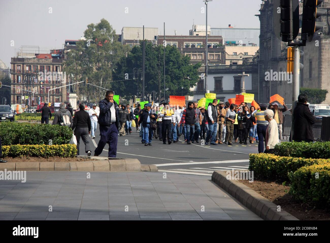 Mexicans protesting peacefully in the central square of Mexico City about jobs and wanting to work - colourful placards Stock Photo