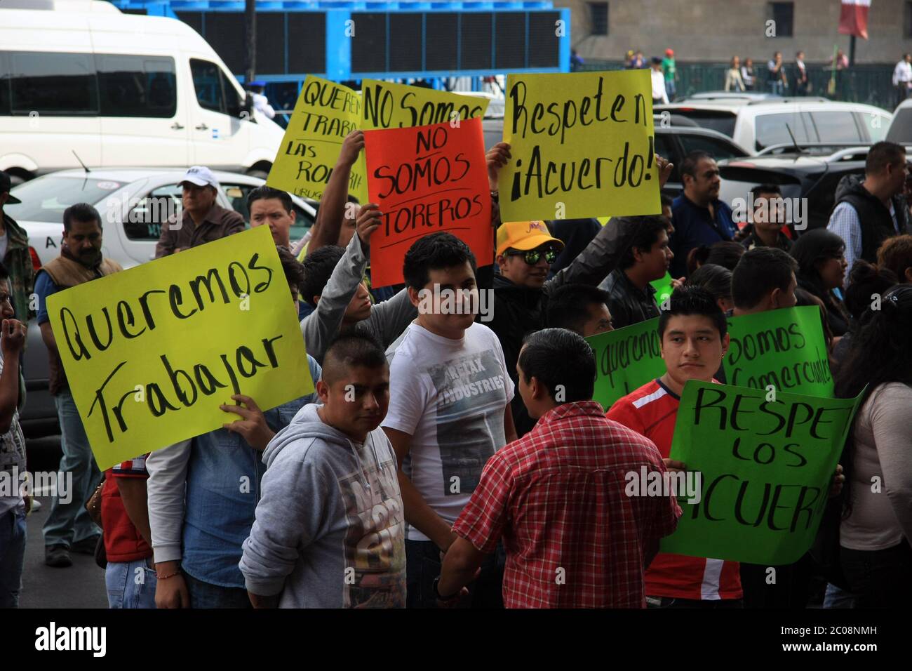 Mexicans protesting peacefully in the central square of Mexico City about jobs and wanting to work - colourful placards Stock Photo