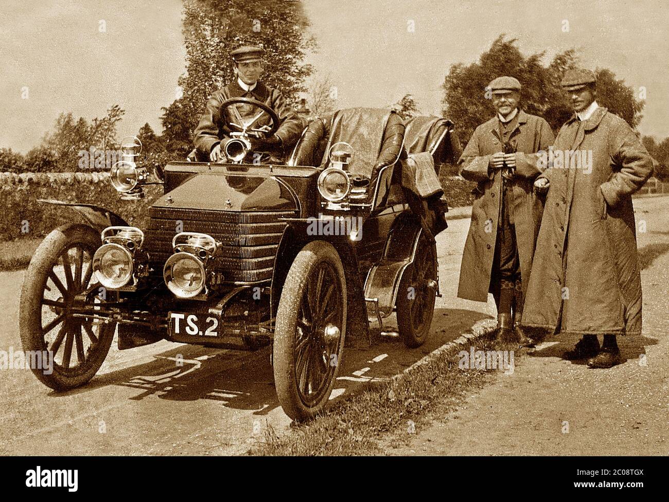 veteran car,chauffeur and passengers,1900's Stock Photo - Alamy