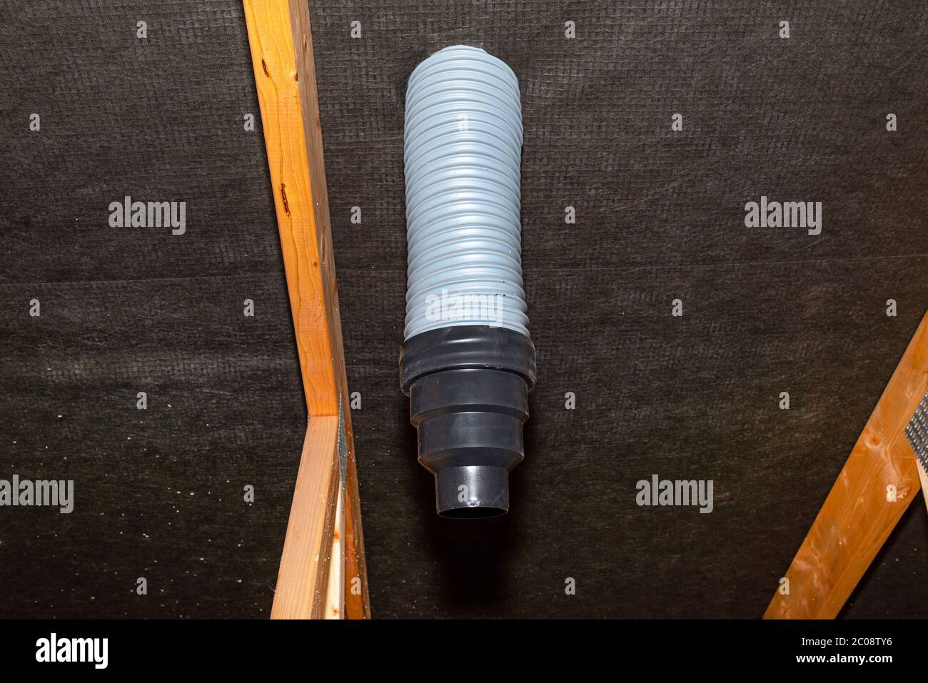 The ends of plastic pipes connected to the chimney of the roofing tile