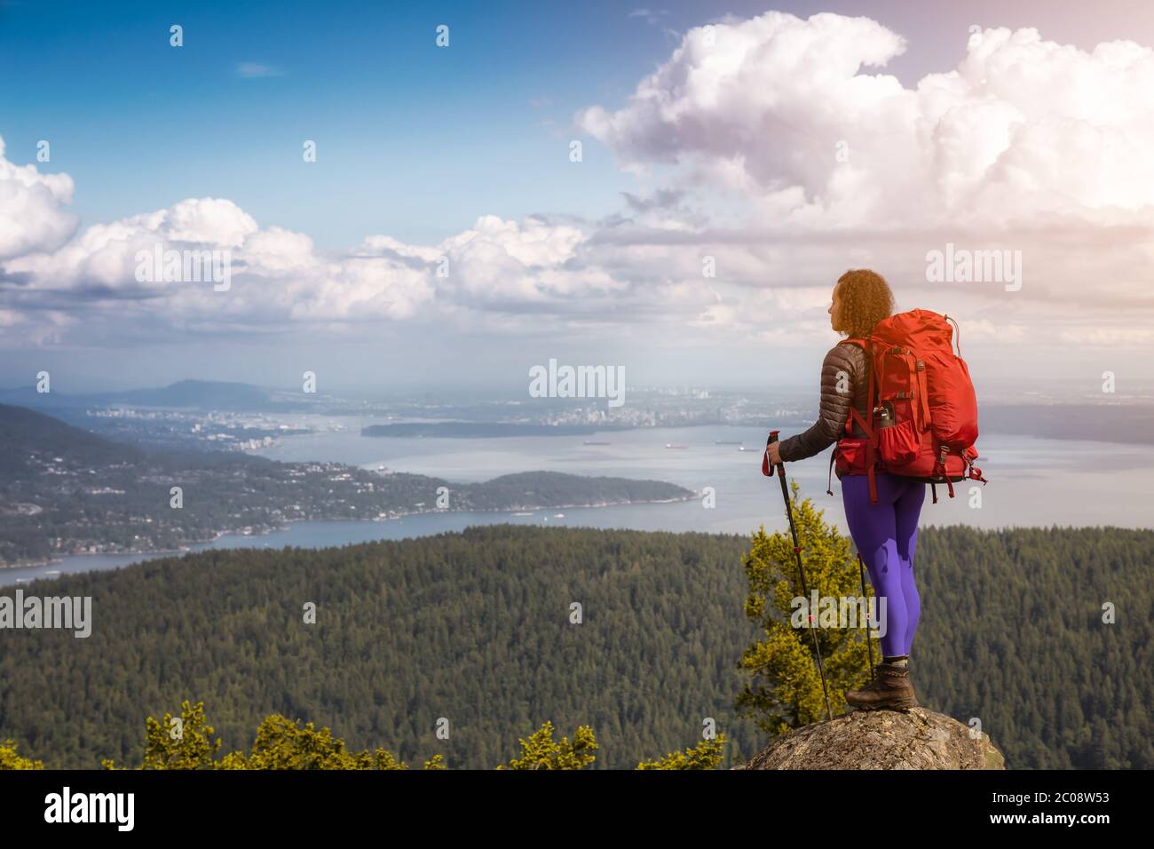 Girl Hiking on top of Mountain in Bowen Island Stock Photo