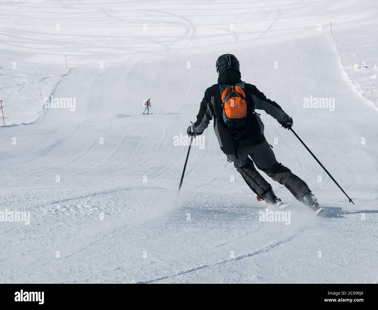 Downhill skier on ski slope, sunny day Stock Photo Alamy