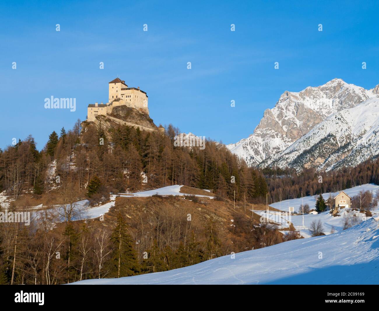 Tarasp Castle - fortified mountain castle in Swiss Alps, Engadin, Switzerland. Stock Photo
