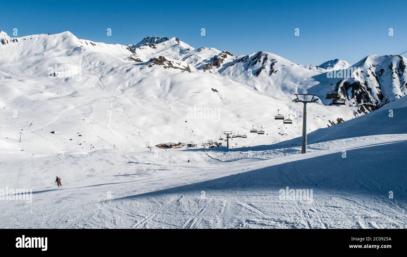 Sunny winter day in alpine ski resort with blue sky and bright white snow, Ischgl and Samnaun, Silvretta Arena, Austria - Switzerland Stock Photo