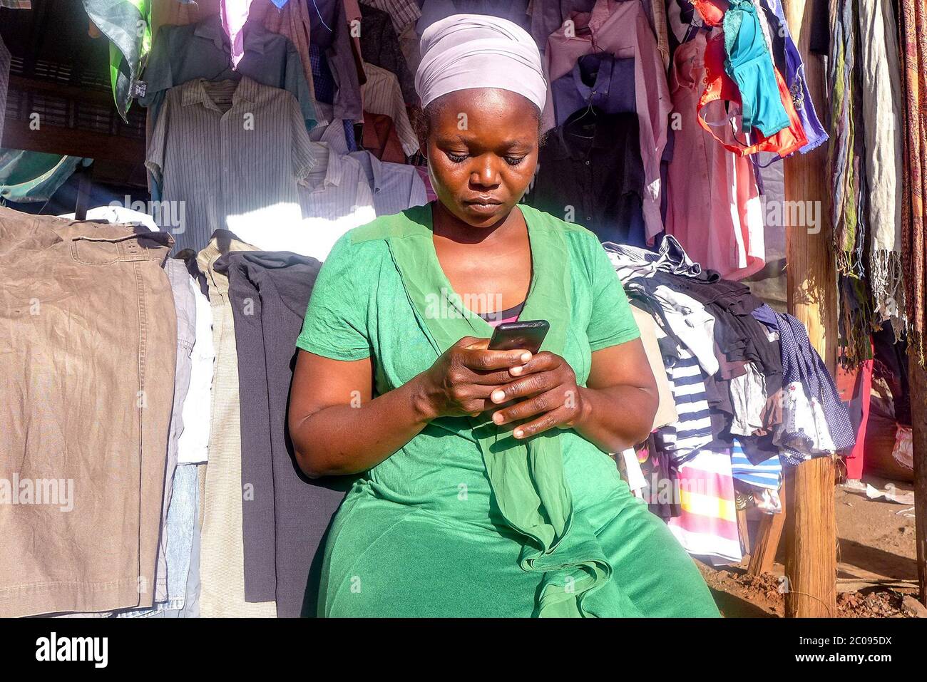 Alice Gochayi has published 10 books on Facebook and WhatsApp. She used a painful experience from her life as inspiration for her writing. She continues to write as she works at a flea market in Harare, Zimbabwe. (Sharon Munjenjema, GPJ Zimbabwe) Stock Photo