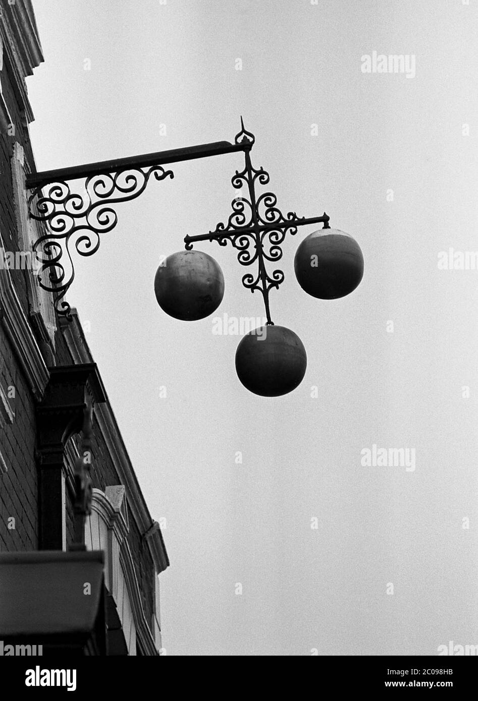 AJAXNETPHOTO. 14TH SEPTEMBER, 1969. PORTSMOUTH, ENGLAND. - SIGN OF THE TIMES - TRADITIONAL THREE BALLS PAWNBROKER SIGN HANGING OUTSIDE SHOP IN ARUNDEL STREET. PHOTO:JONATHAN EASTLAND/AJAX REF:356947 15 63 Stock Photo