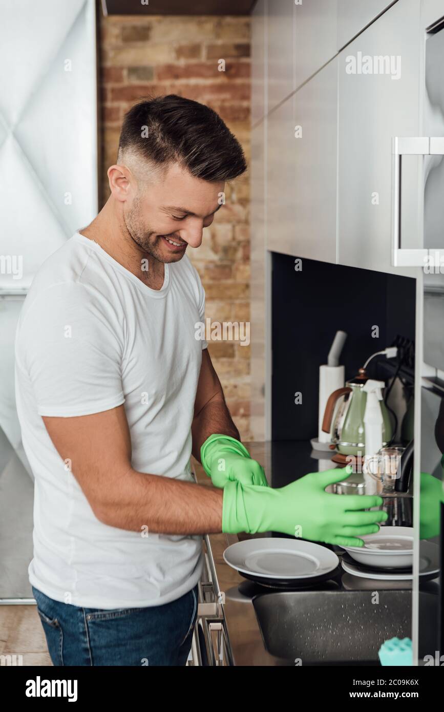 Man wearing rubber gloves hires stock photography and images Alamy