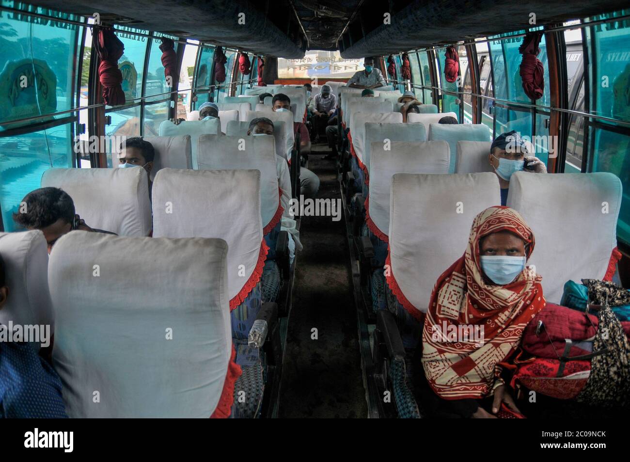 Inter district bus authority arranged sitting with proper social distance in Sylhet - Dhaka highway as as possible to continue their business amid the Stock Photo