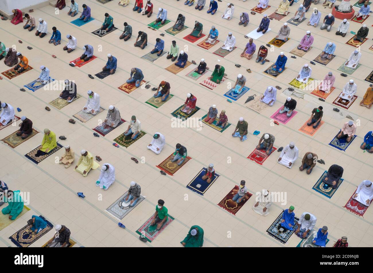 Muslims attend Friday prayers in congregation at Hazrat Shahjalal (R) mosque, Sylhet, Bangladesh while taking health protocols and proper social maint Stock Photo