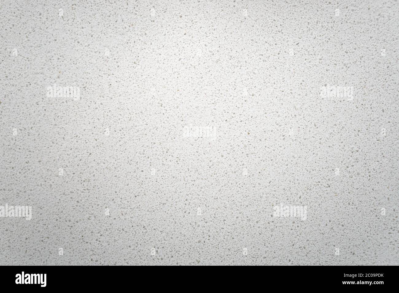 White quartz background countertop texture. This light background is taken from a bright off-white quartz kitchen counter. Stock Photo