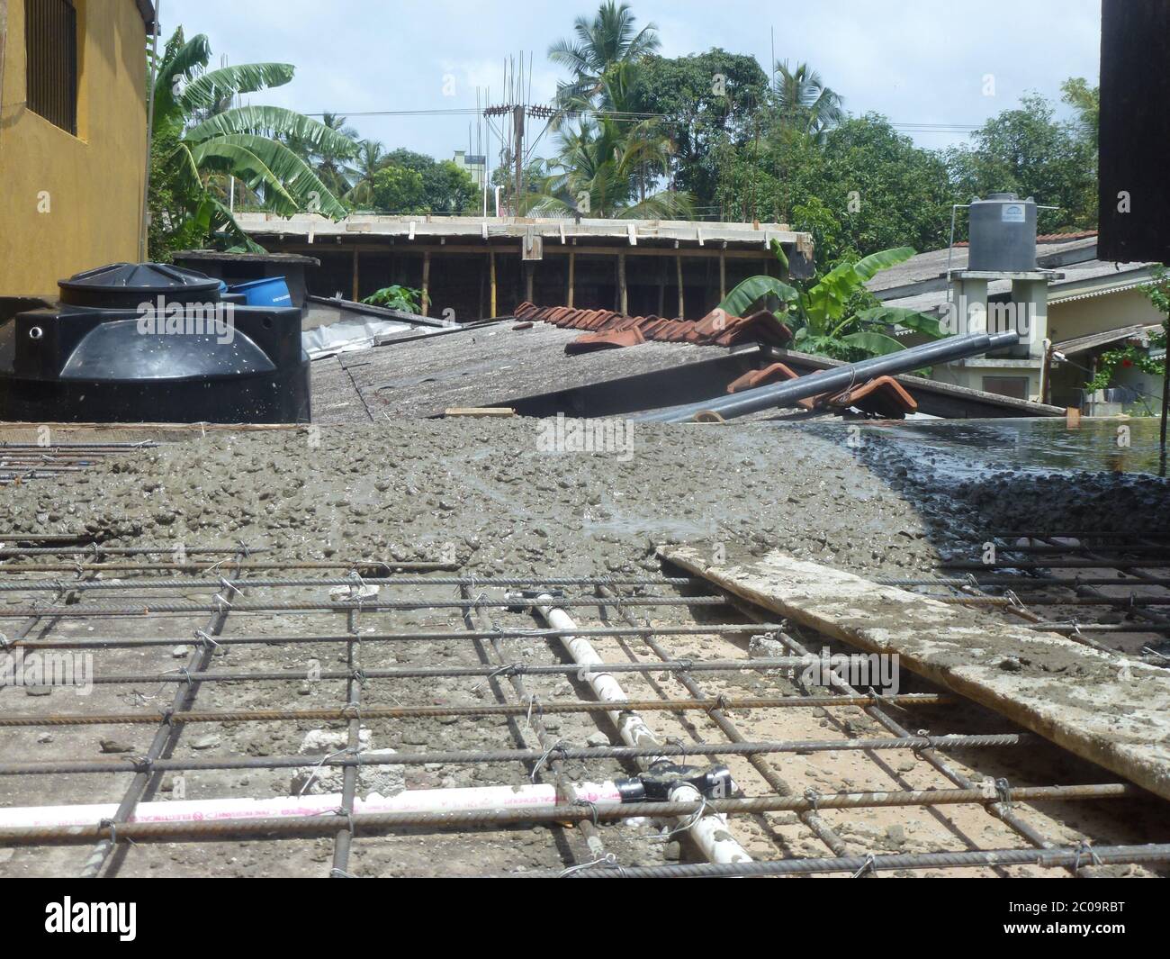Men Working At A Construction Site Involved With Mason Work A New Concrete Slab Has Just Been Put Colombo Sri Lanka Stock Photo Alamy