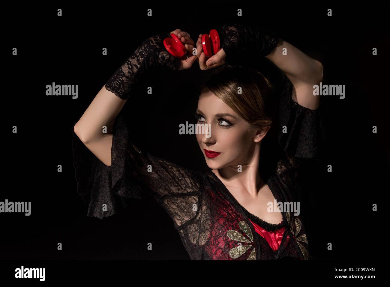 attractive dancer holding while dancing flamenco isolated on