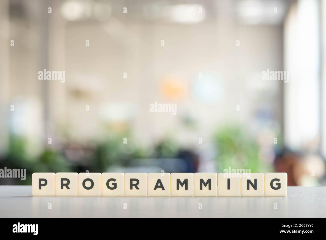 white cubes with programming inscription on office desk Stock Photo
