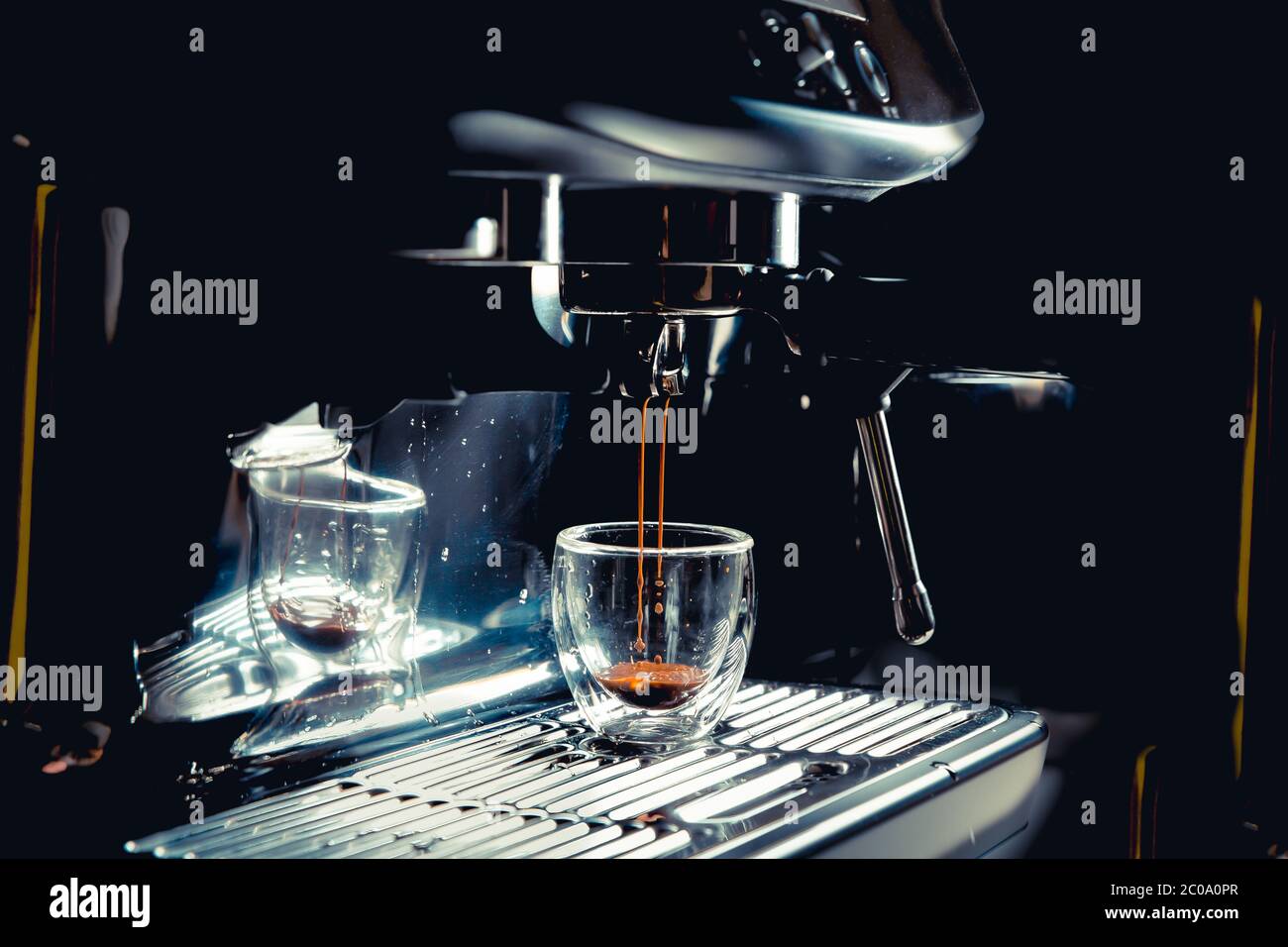 https://c8.alamy.com/comp/2C0A0PR/dark-coffee-drops-dripping-in-a-transparent-glass-espresso-cup-on-a-manual-espresso-machine-with-copy-space-close-up-2C0A0PR.jpg