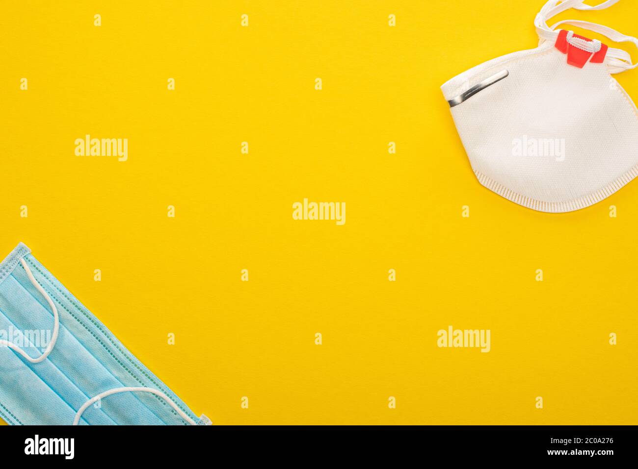 top view of medical and safety masks on yellow background Stock Photo ...