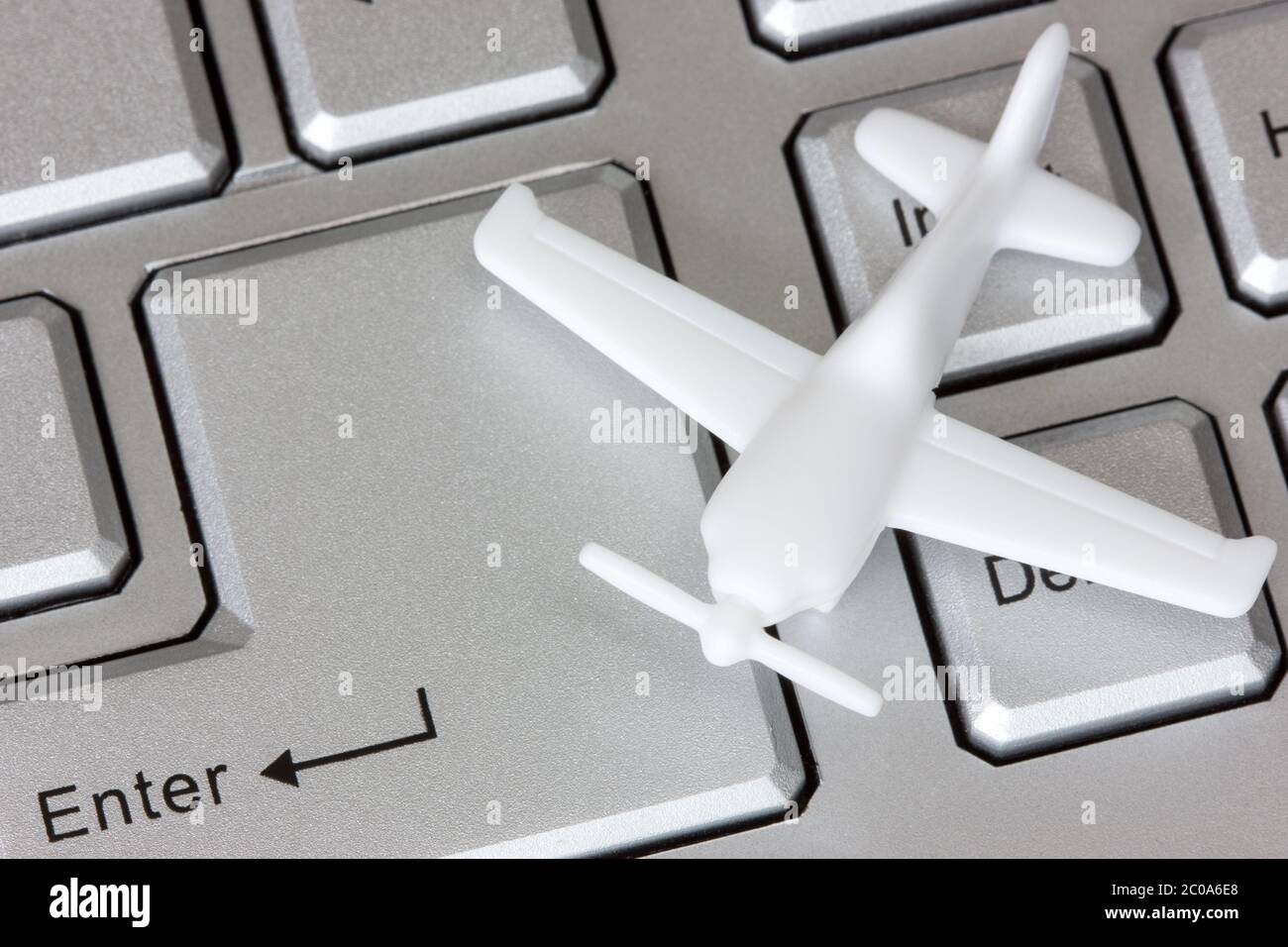 Plane on keyboard Stock Photo Alamy