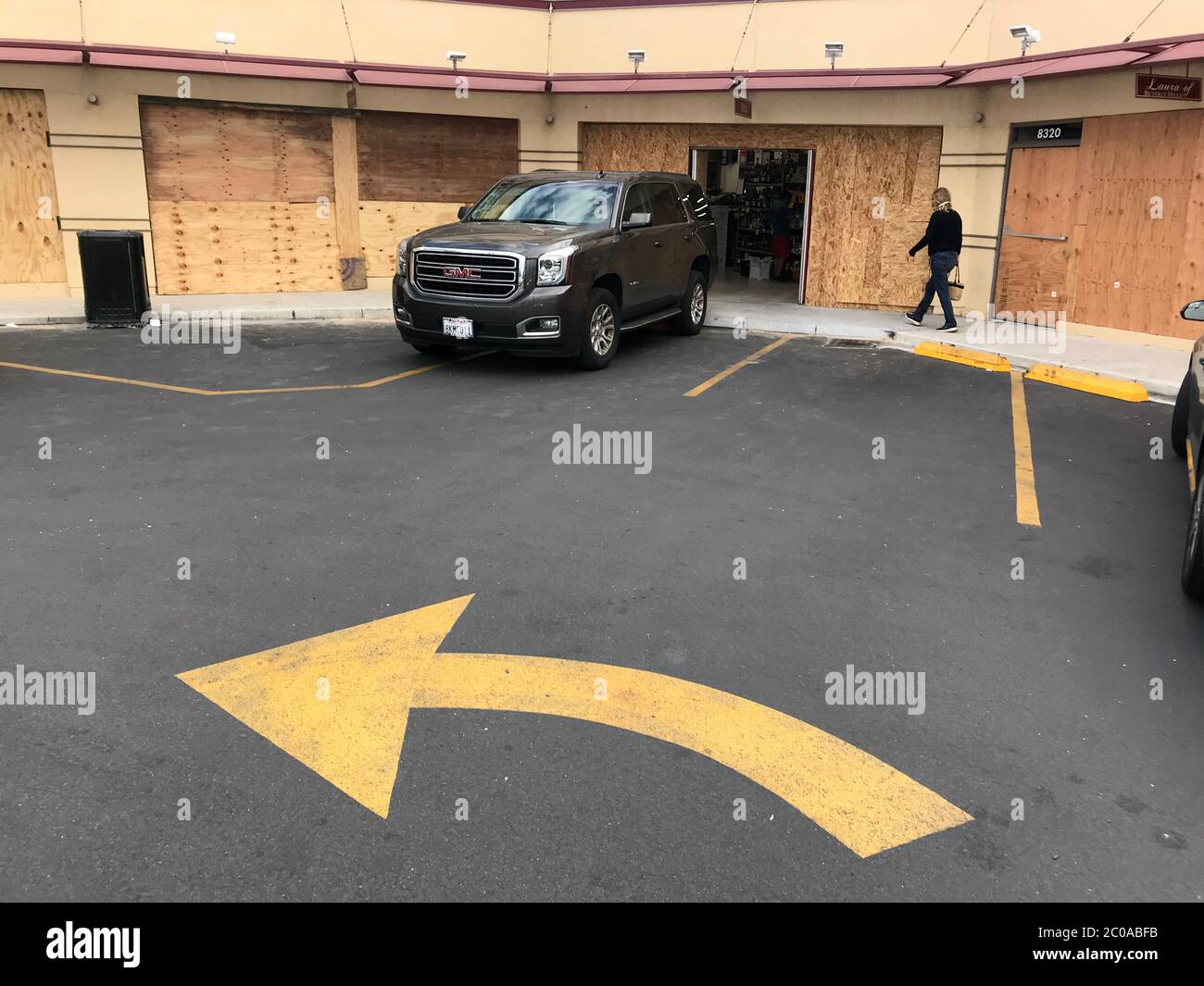 Boarded up shops in a Beverly HIlls mini mall on Wilshire Blvd. in Los Angeles, CA after looting. Stock Photo