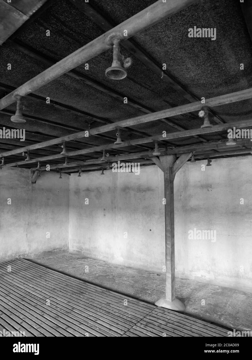 Bathroom with showers in concentration camp. In black and white. Stock Photo
