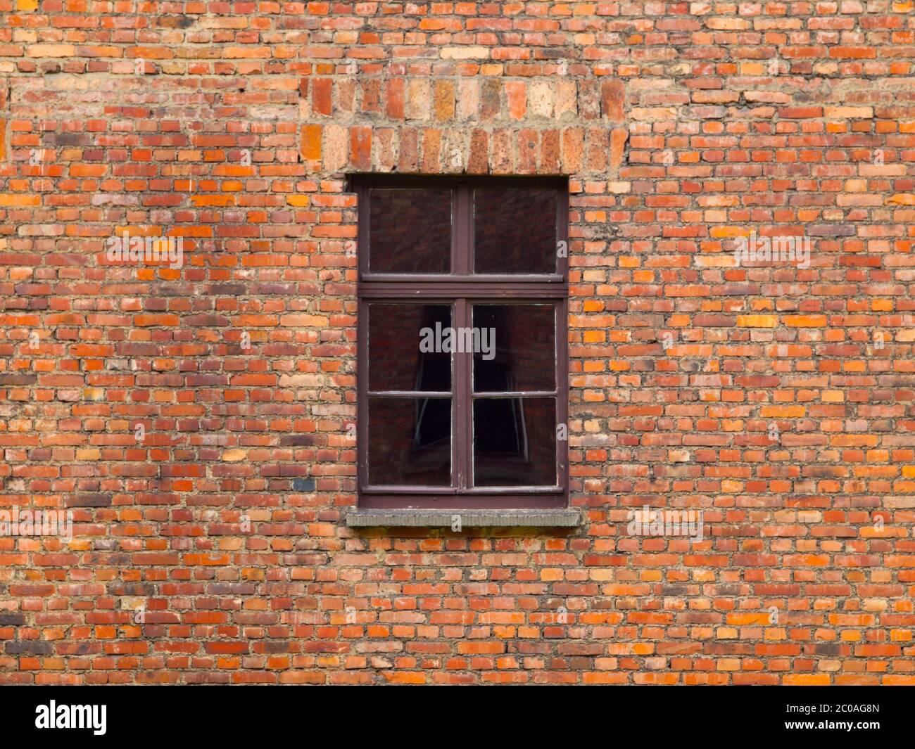 Old brick wall with brown window in the centre Stock Photo - Alamy