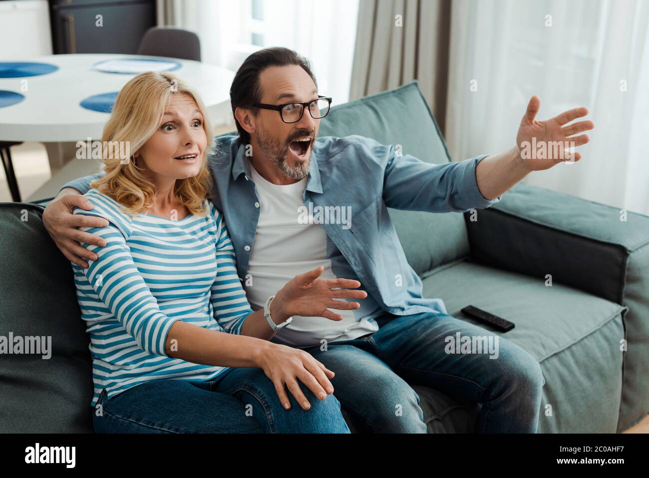 Beautiful mature woman watching tv hi-res stock photography and images ...