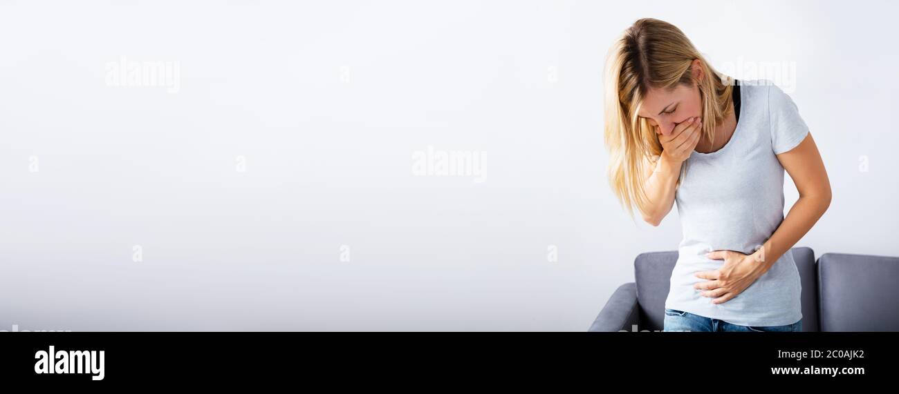 Ectopic Pregnancy, Indigestion, Nausea And PMS Stomach Pain Stock Photo