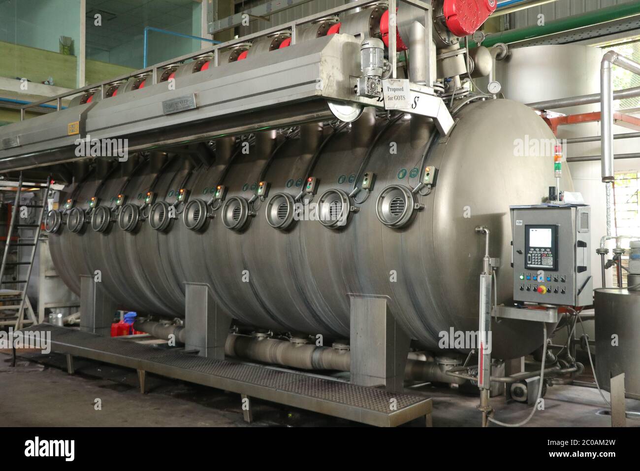 Modern technology in dyeing yarns with Machines for Textile Industry, Dyeing Machine Chemical Tanks Stock Photo