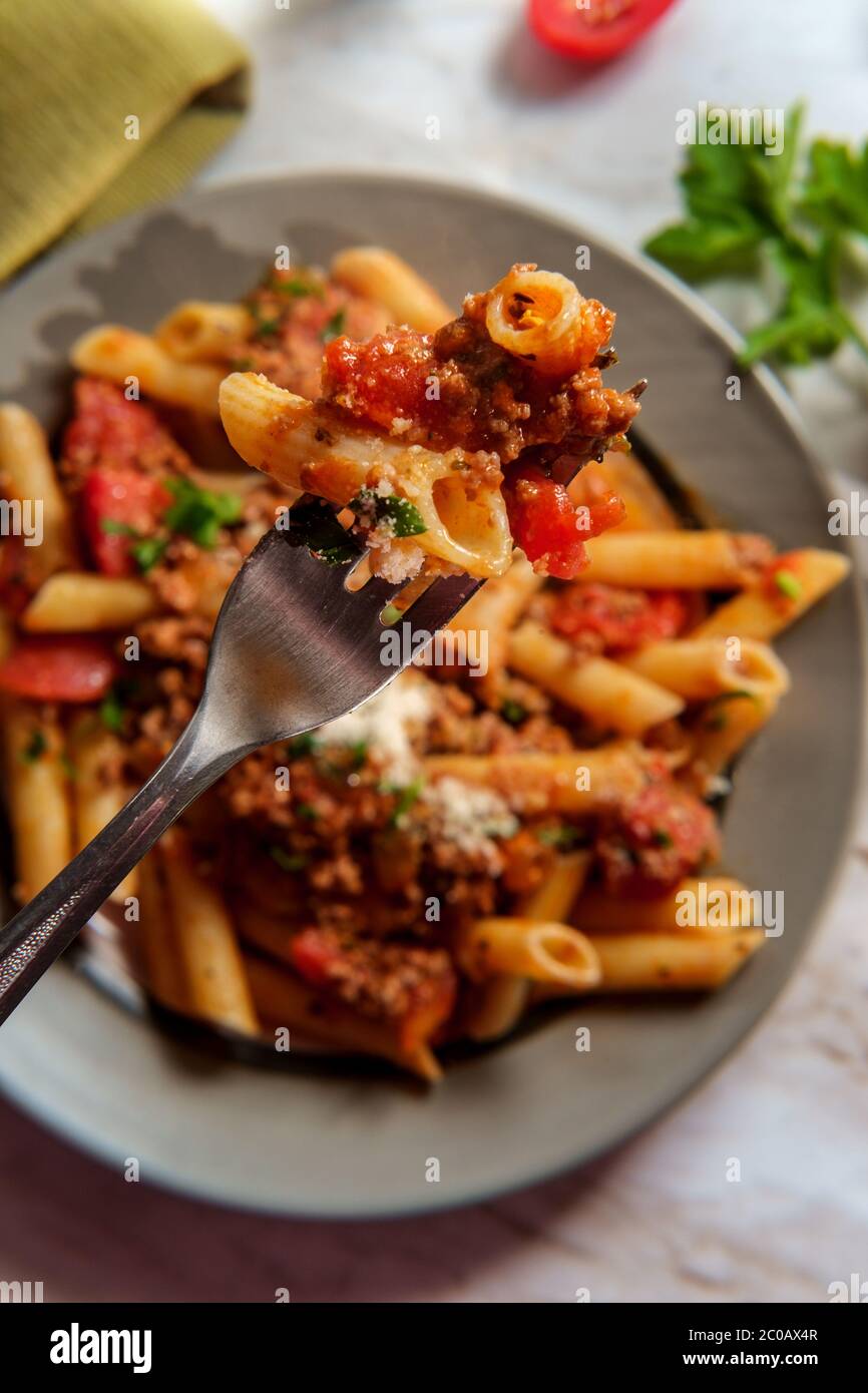 Authentic Italian dinner penne ragu alla bolognese Stock Photo Alamy