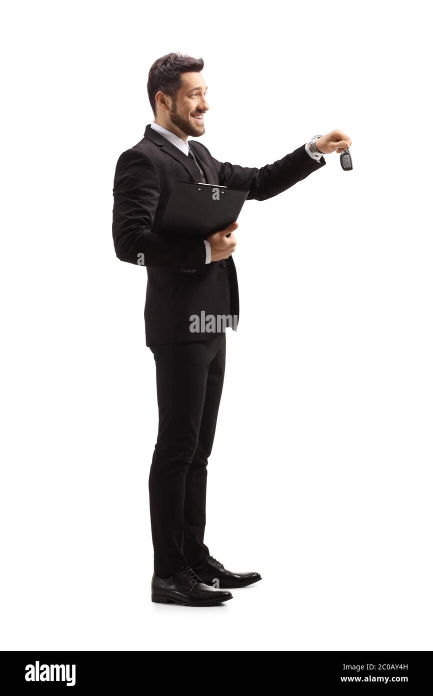 Full length profile shot of a businessman giving car keys isolated on white background Stock Photo
