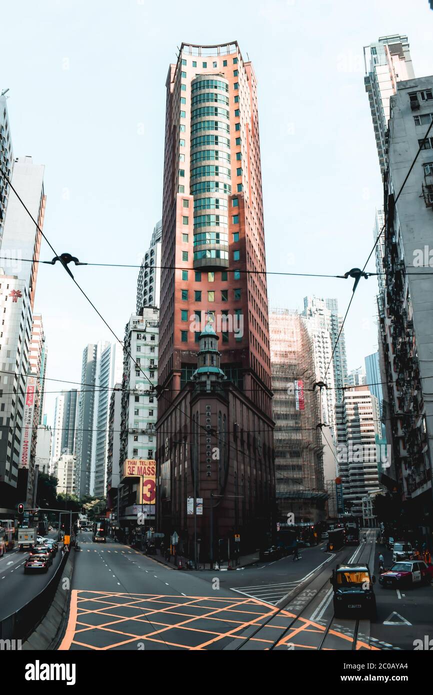 Elegant tall corner office building on the streets of Hong Kong Island Stock Photo