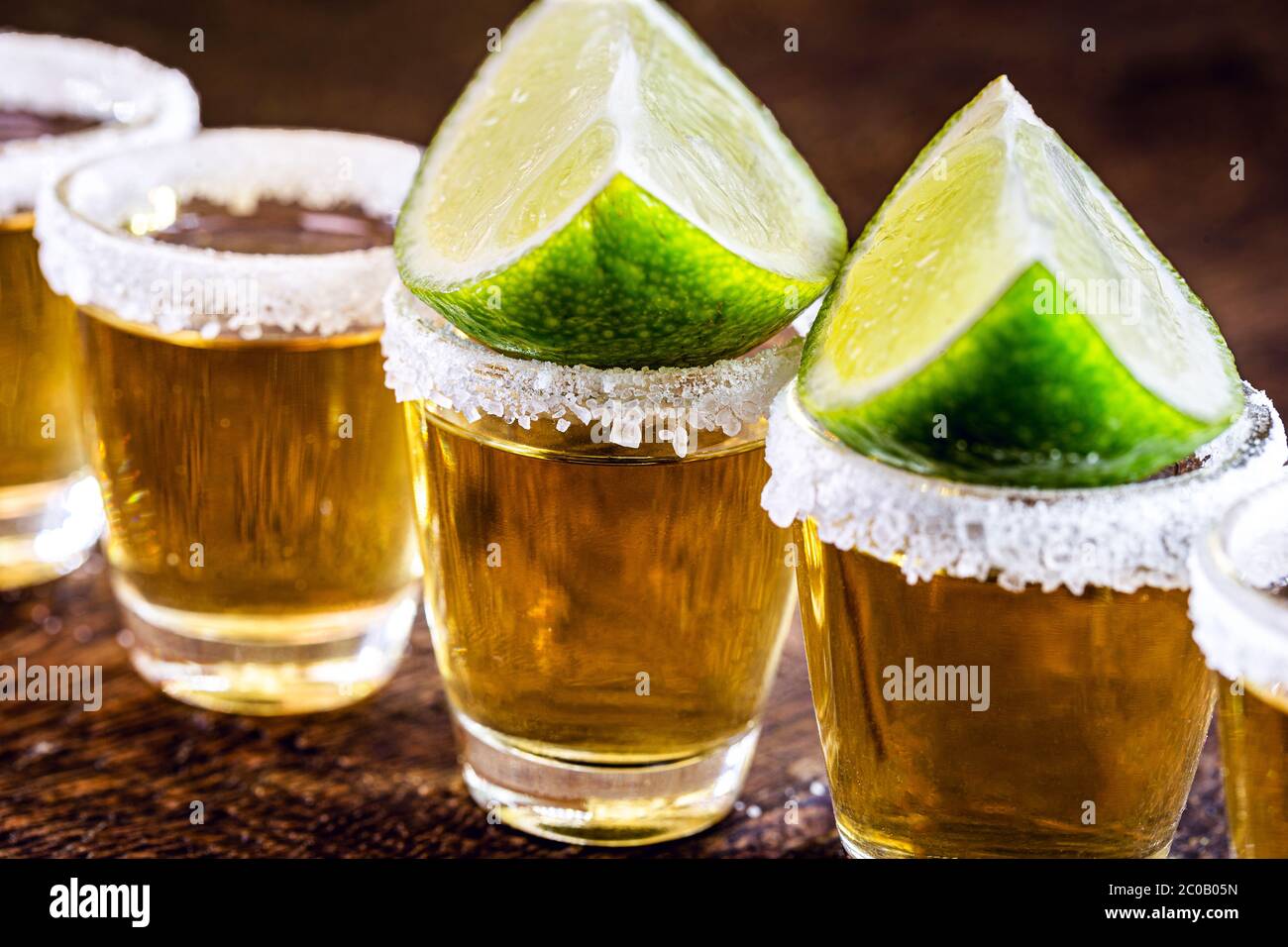 detail of the tequila drink, with a specific focus on the lemon