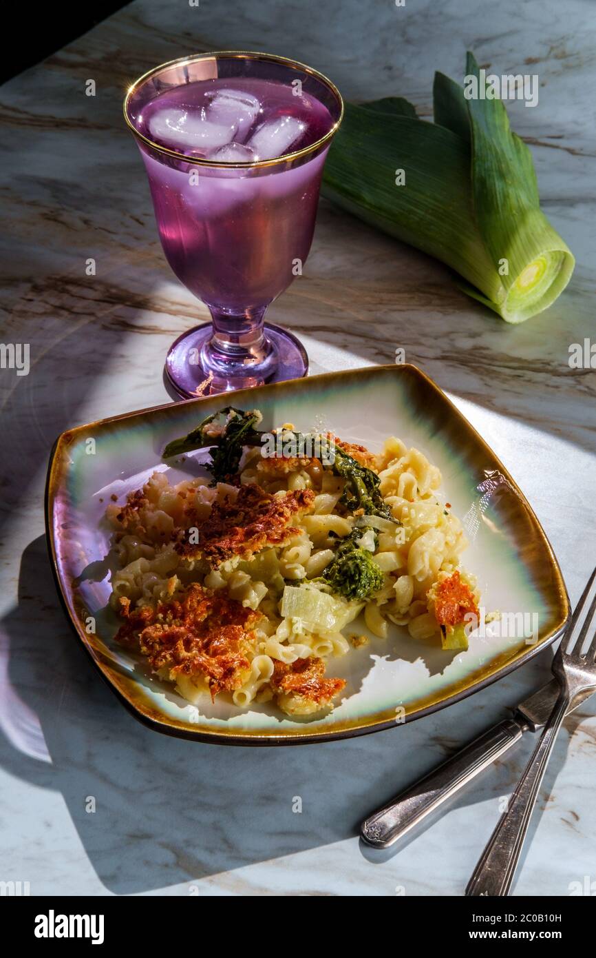 Broccoli rabe and leek mac and cheese with harsh sunlight Stock Photo