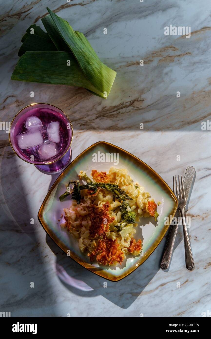 Broccoli rabe and leek mac and cheese with harsh sunlight Stock Photo