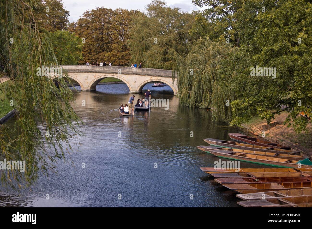 Cambridge, UK - September 19, 2011:  University students punting along the River Cam in Cambridge on September 19 2011. Competition to rent the small Stock Photo