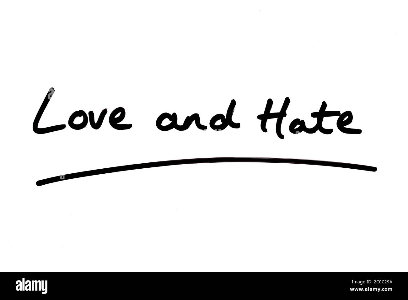 Love and Hate handwritten on a white background. Stock Photo