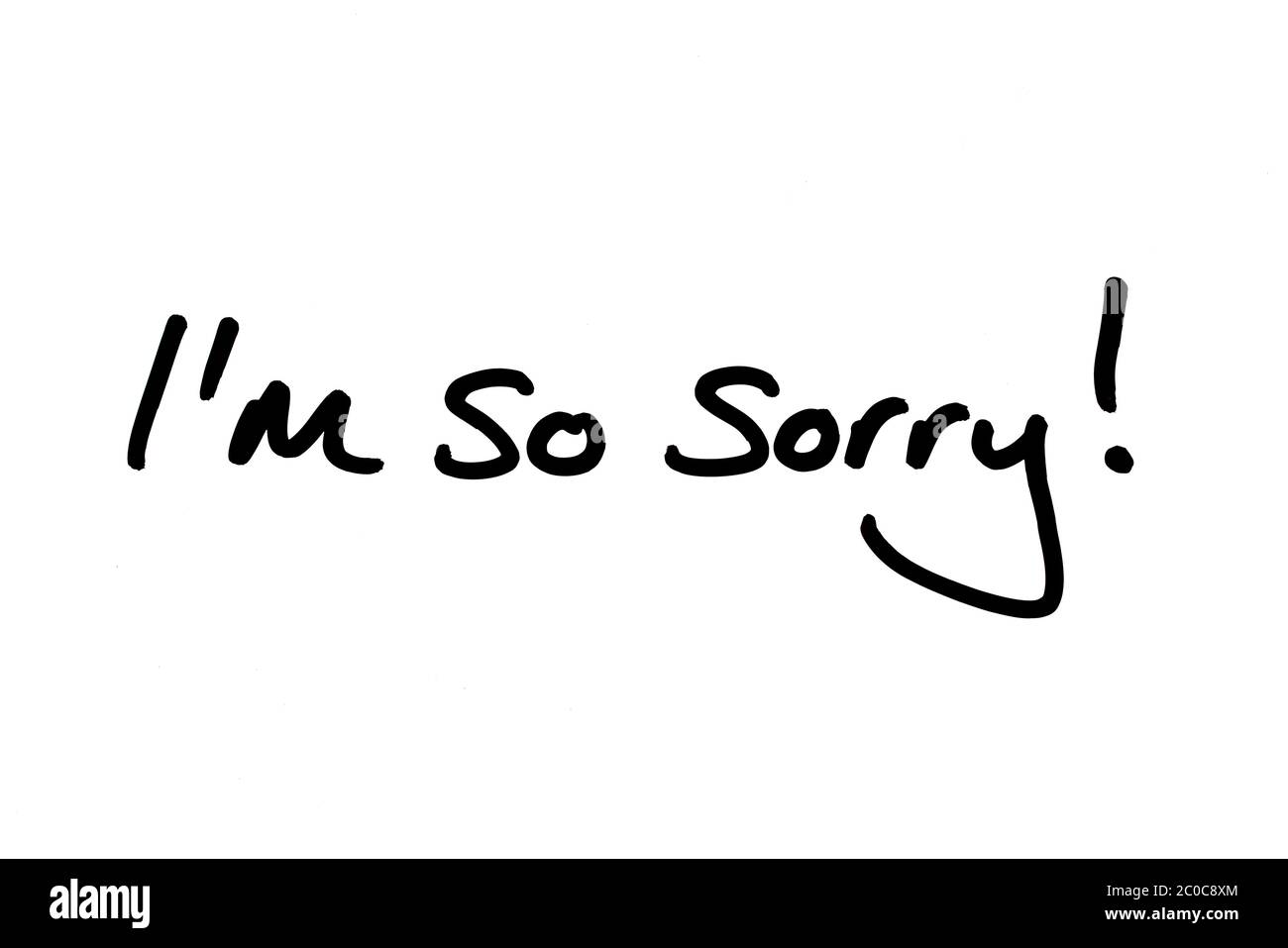 I’m so sorry! handwritten on a white background. Stock Photo
