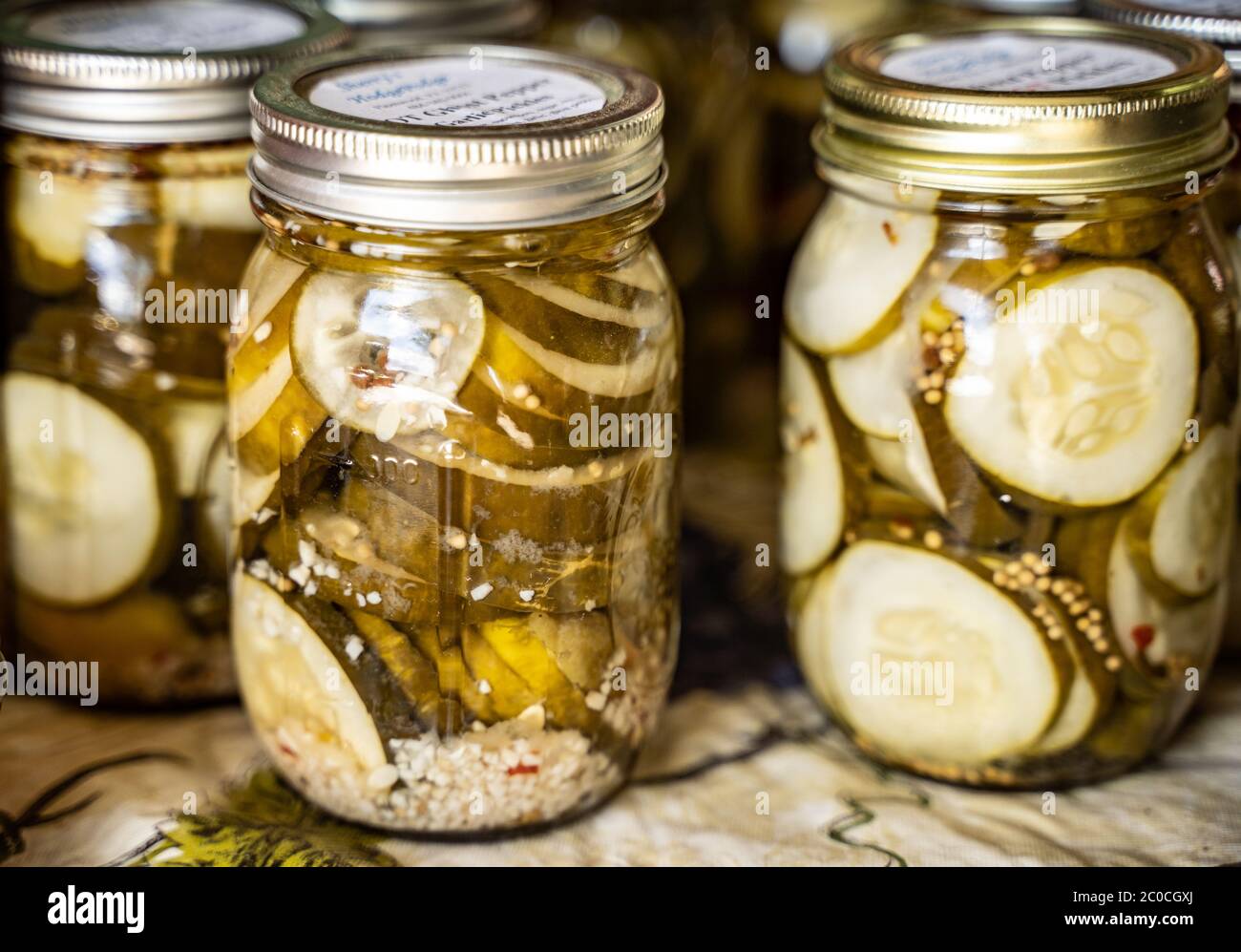 Homemade pickles in mason jars at Farmer's Market Stock Photo Alamy