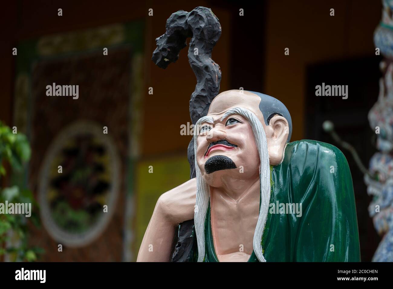 Statue of a Buddhist pensive man in a chinese temple in the city of Danang, Vietnam. Close up Stock Photo